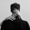 woman hands on man neck