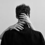 woman hands on man neck