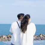 couple enjoying ocean view on a sunny day